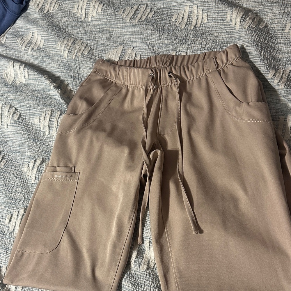Woman’s tan scrub pants